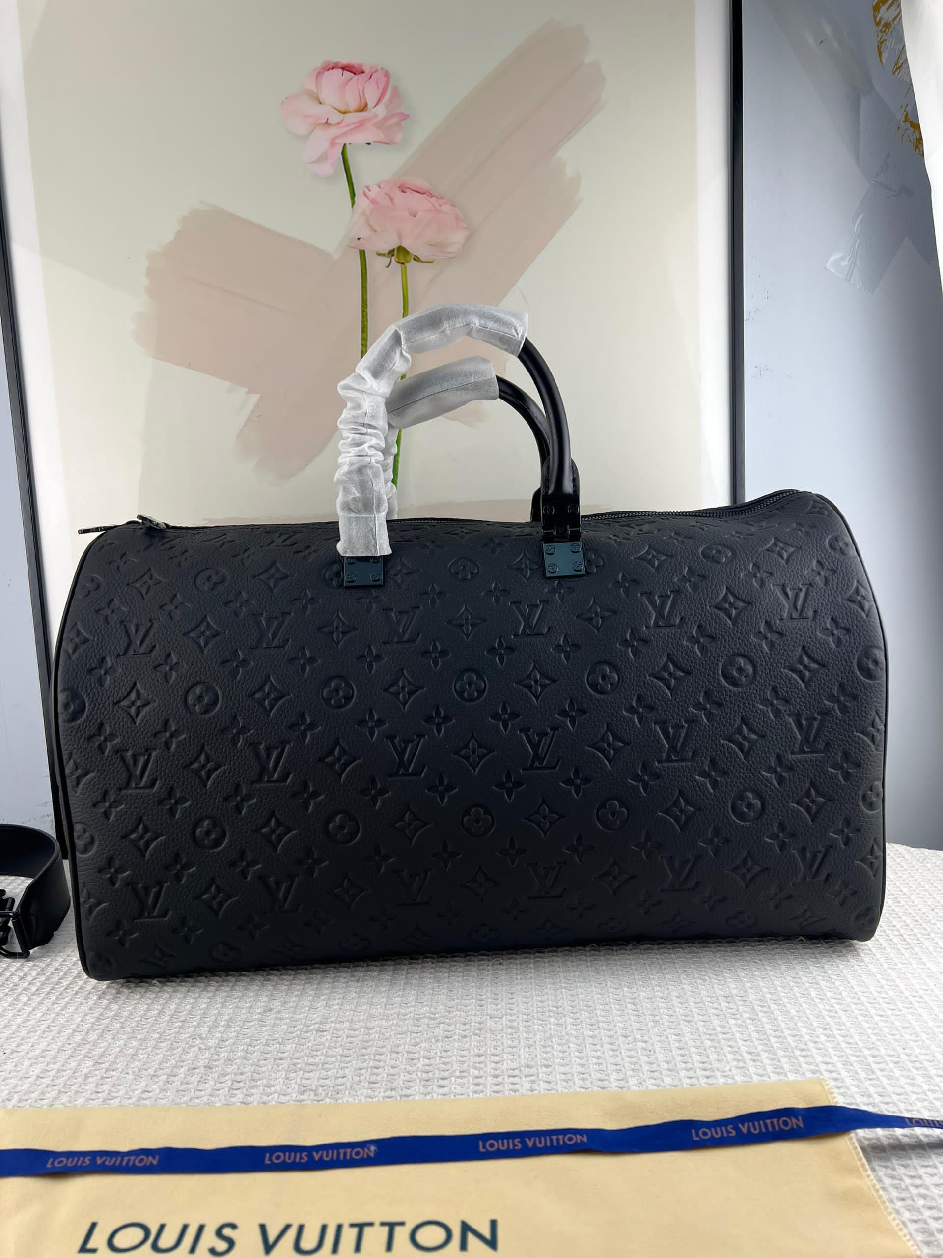 KEEPALL 50 ÇAPRAZ GÖVDELİ SEYAHAT ÇANTASI Louis Vuitton - Glimmer of Luxury