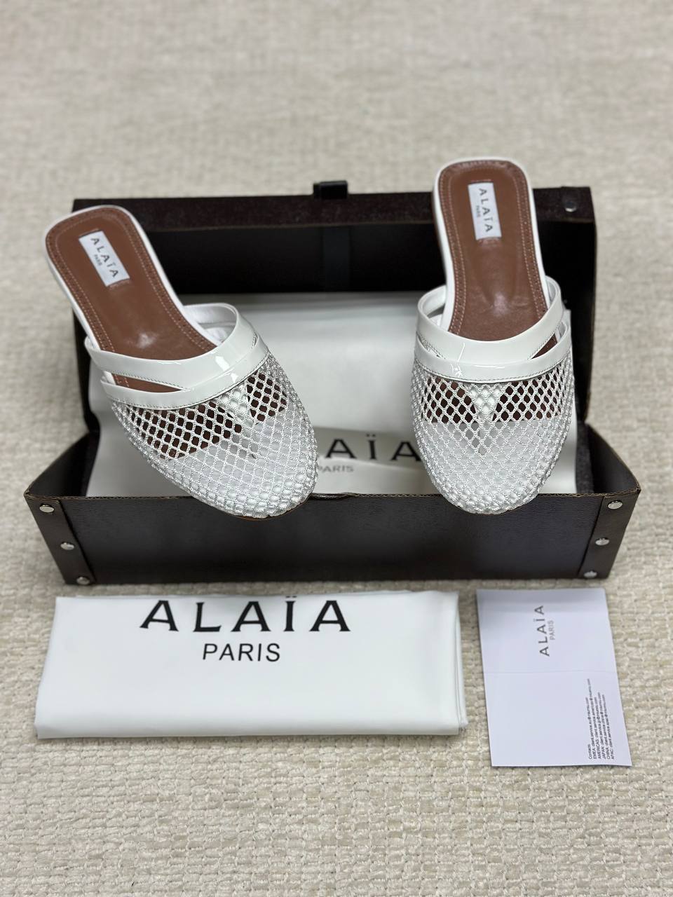 Alaia Infradito Flat Slippers