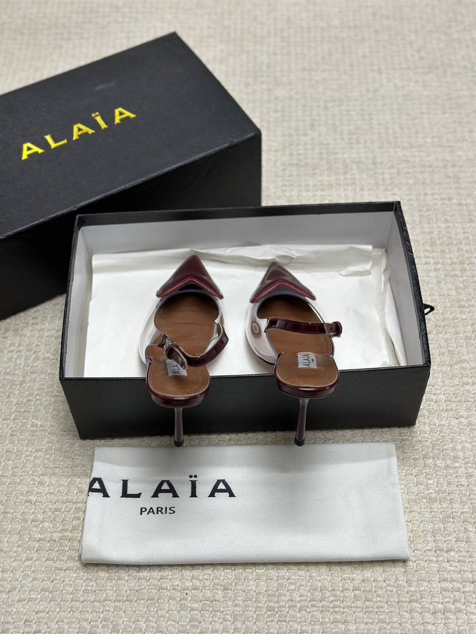 ALAIA LE CŒUR Open Back Open Back in Patent Lambskin