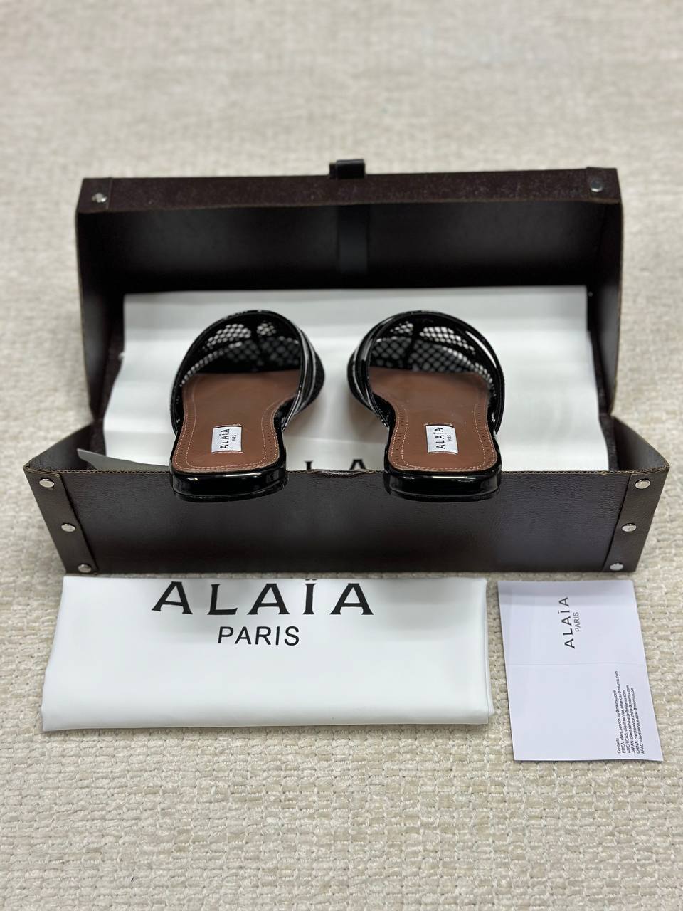 Alaia Infradito Flat Slippers