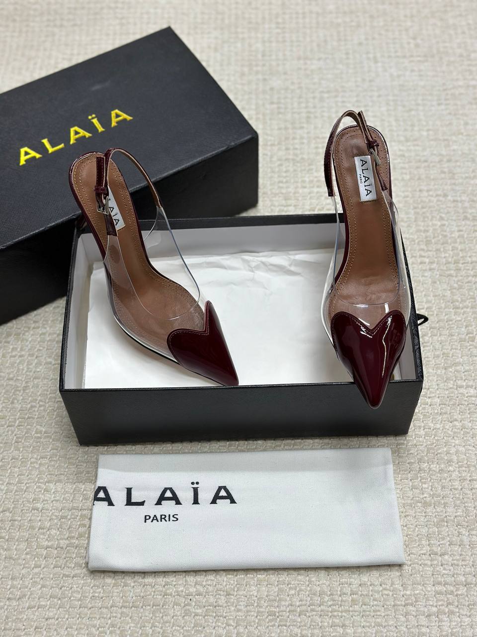 ALAIA LE CŒUR Open Back Open Back in Patent Lambskin