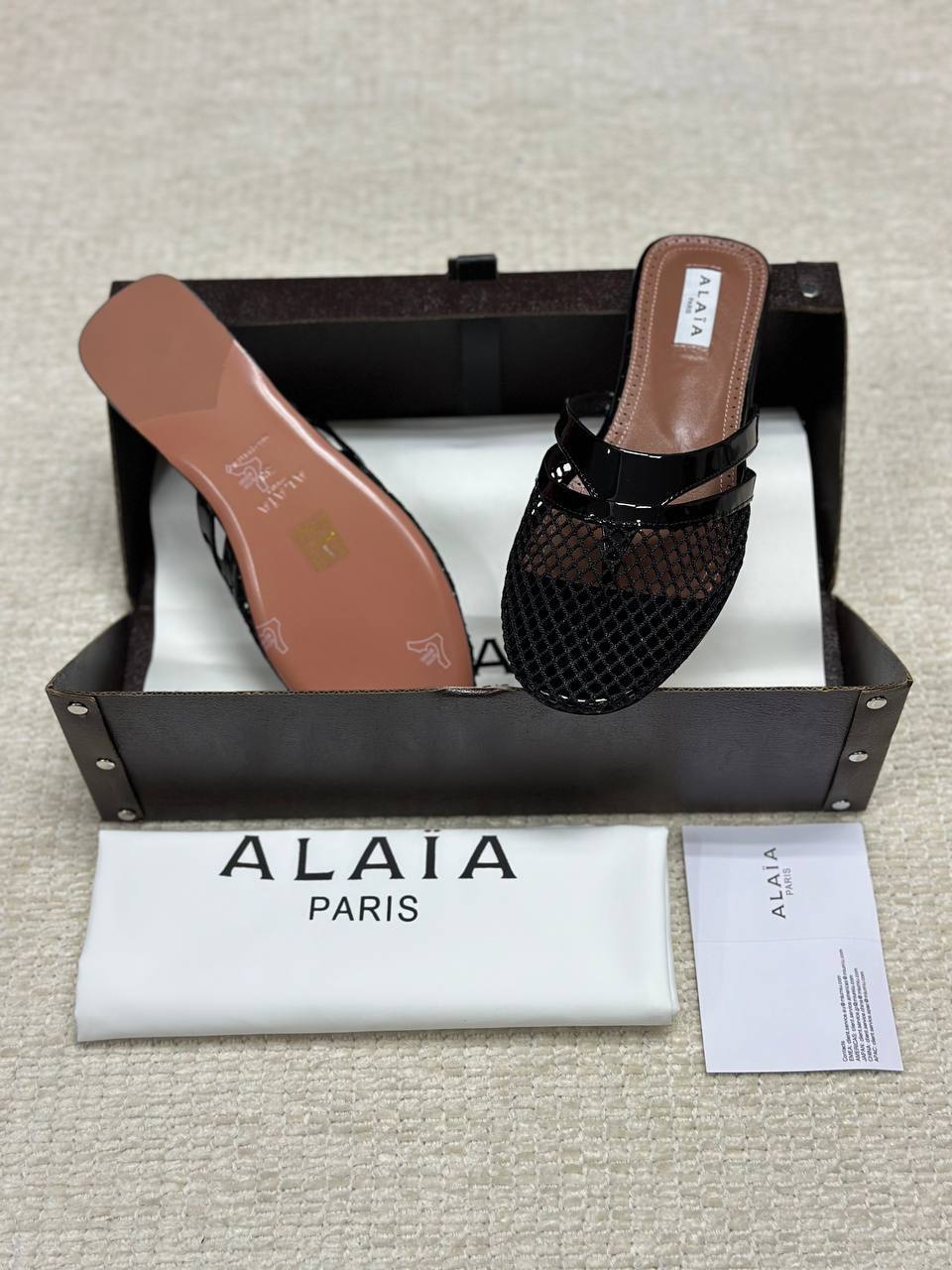 Alaia Infradito Flat Slippers