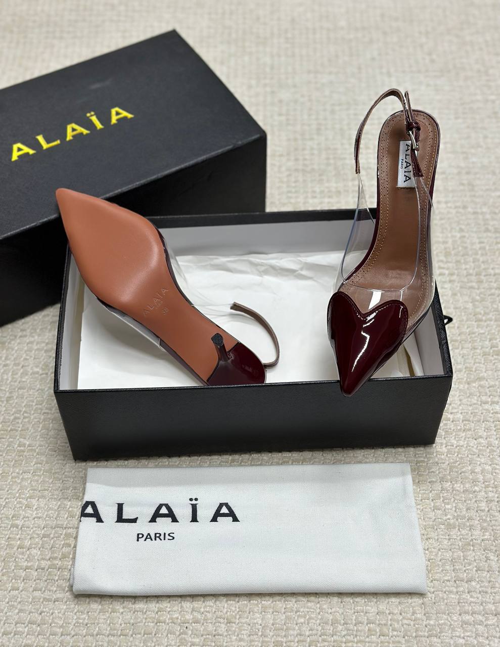 ALAIA LE CŒUR Open Back Open Back in Patent Lambskin