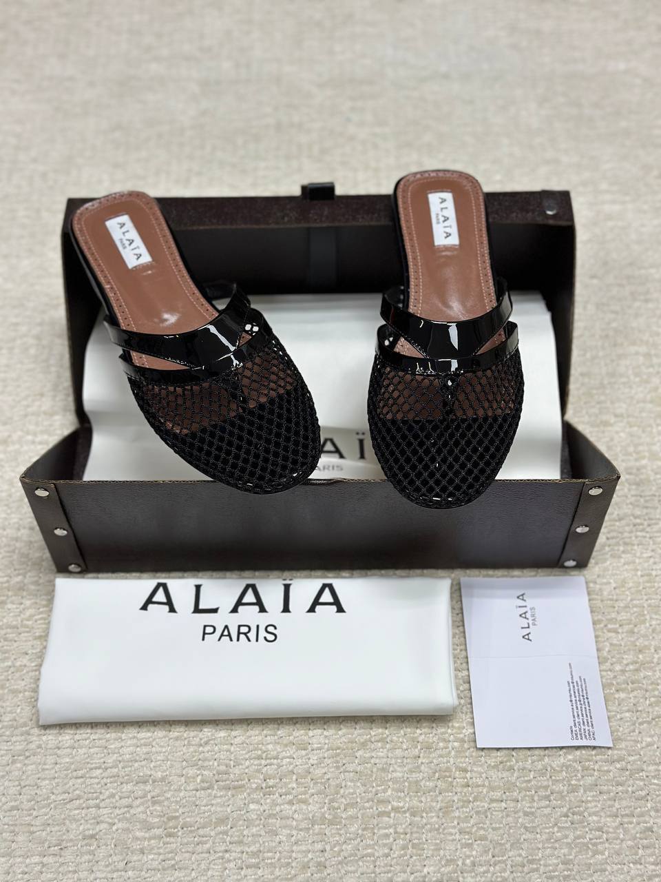 Alaia Infradito Flat Slippers