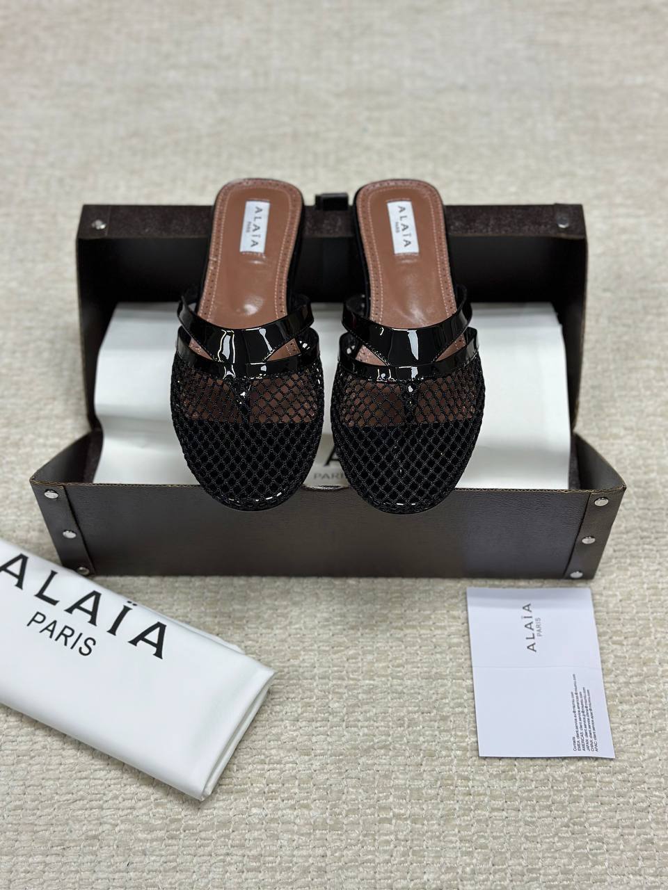 Alaia Infradito Flat Slippers