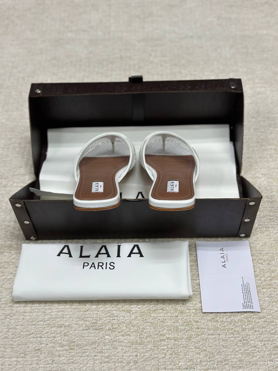 Alaia Infradito Flat Slippers