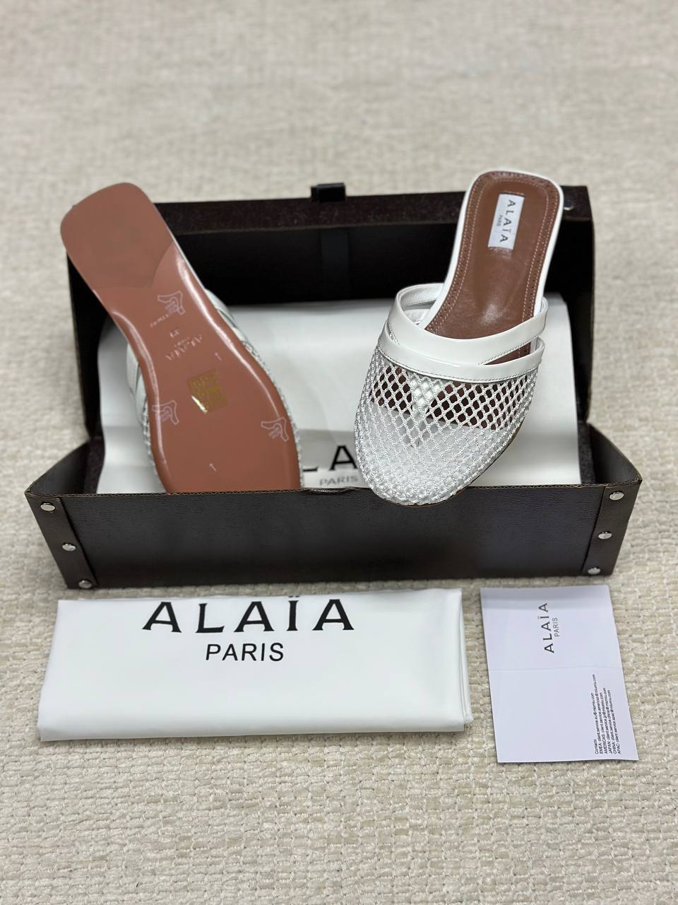 Alaia Infradito Flat Slippers