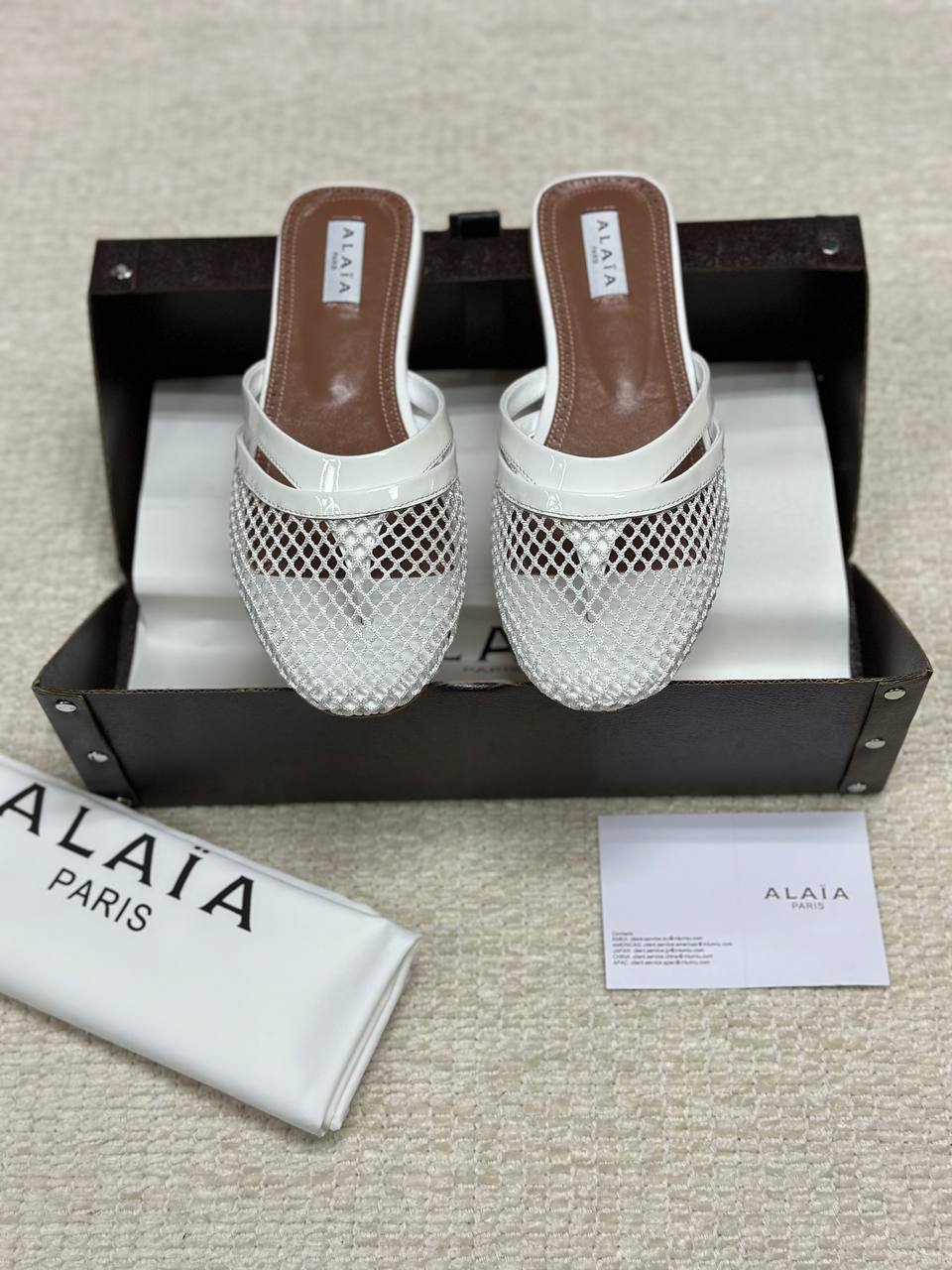 Alaia Infradito Flat Slippers